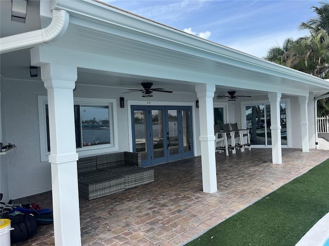 view of patio featuring ceiling fan and french doors