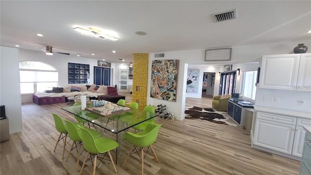 dining room featuring light wood-style floors, ceiling fan, visible vents, and recessed lighting