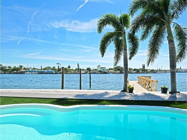 view of swimming pool featuring a water view