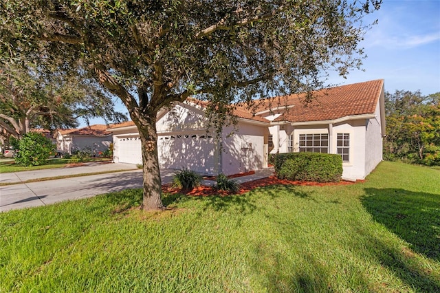 mediterranean / spanish-style home with a garage and a front lawn