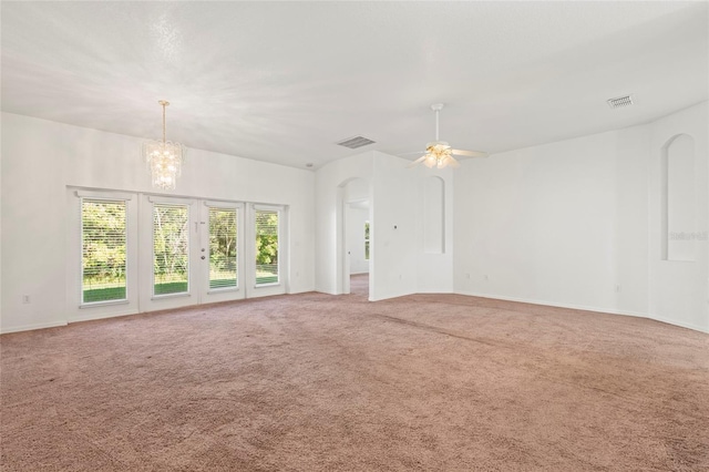 unfurnished living room with carpet flooring and ceiling fan with notable chandelier