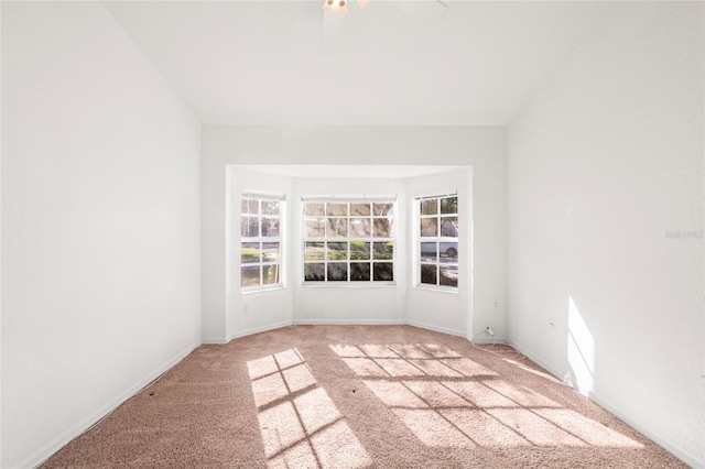 unfurnished room featuring carpet and ceiling fan