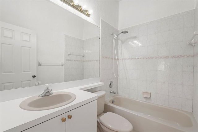 full bathroom with vanity, toilet, and tiled shower / bath