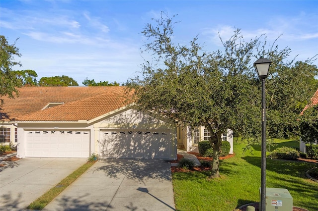 view of front facade with a front yard and a garage