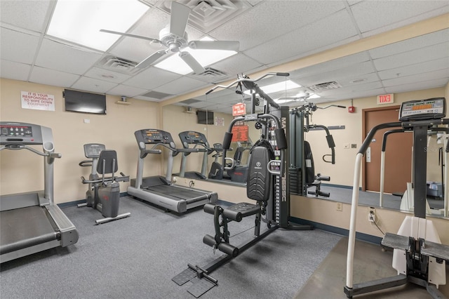 workout area featuring a drop ceiling and ceiling fan