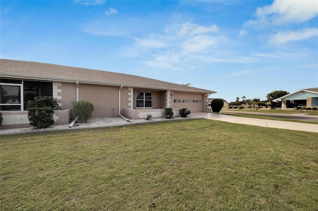 single story home with a garage and a front lawn