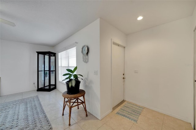 entryway with light tile patterned flooring