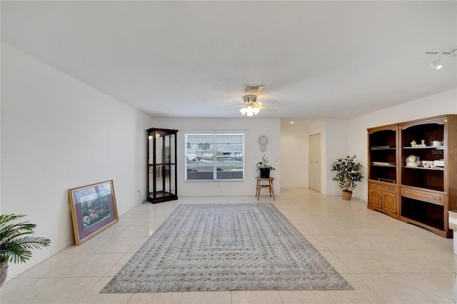 interior space featuring ceiling fan