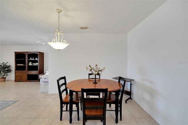 dining space featuring light tile patterned flooring