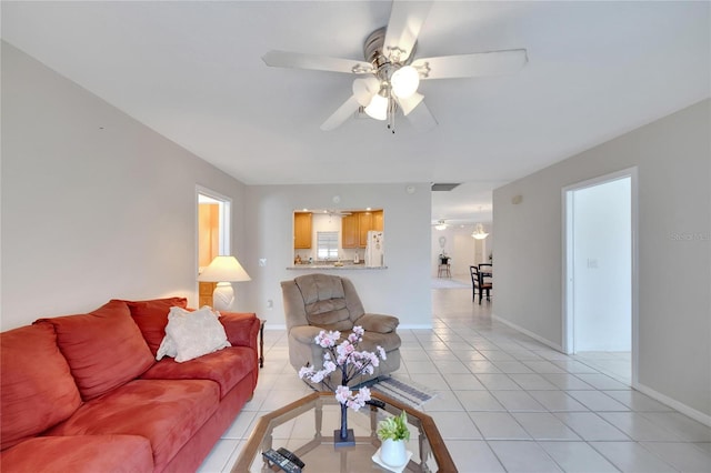 tiled living room featuring ceiling fan