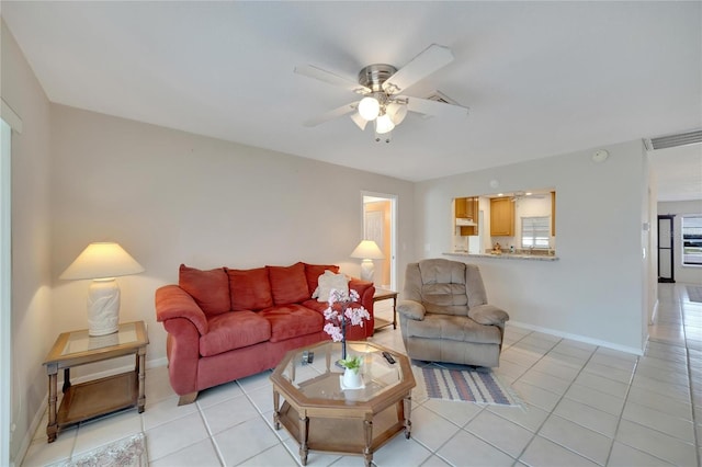 living room featuring ceiling fan and light tile patterned floors