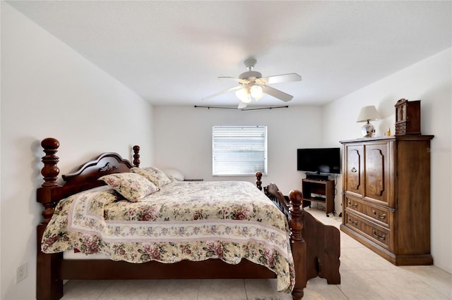 tiled bedroom with ceiling fan