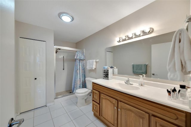 bathroom featuring toilet, a shower with curtain, vanity, and tile patterned floors