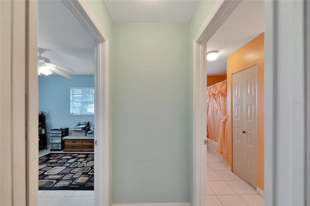 corridor with light tile patterned floors