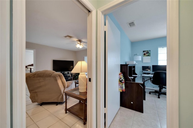 home office featuring ceiling fan and light tile patterned flooring