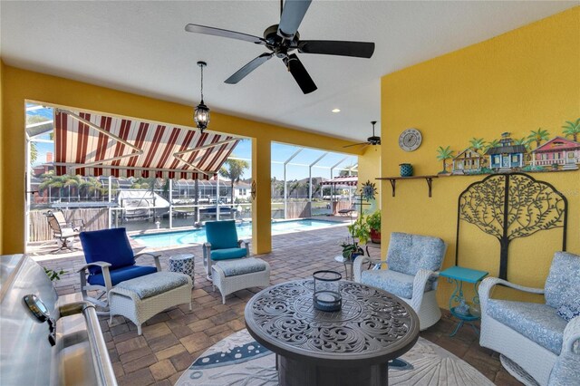 721 Manns Harbor Dr, Apollo Beach, FL 33572 - view of patio / terrace featuring an outdoor pool and a ceiling fan