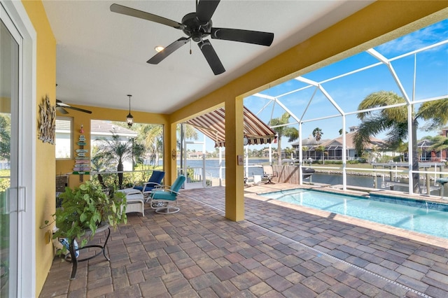 721 Manns Harbor Dr, Apollo Beach, FL 33572 - swimming pool featuring ceiling fan, a patio, a water view, and a lanai