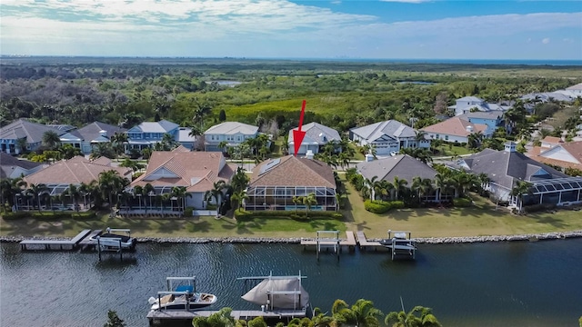 birds eye view of property featuring a water view