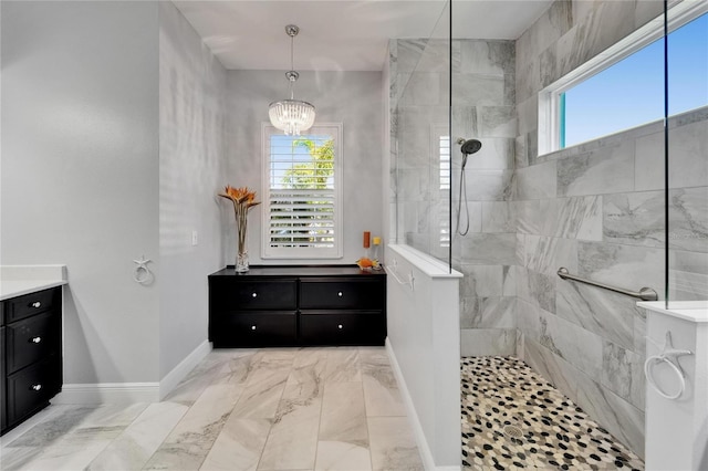 721 Manns Harbor Dr, Apollo Beach, FL 33572 - bathroom with vanity, healthy amount of natural light, walk in shower, and a chandelier