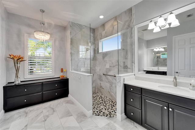 721 Manns Harbor Dr, Apollo Beach, FL 33572 - full bath with a chandelier, walk in shower, marble finish floors, and vanity