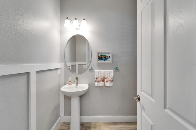 721 Manns Harbor Dr, Apollo Beach, FL 33572 - bathroom with baseboards and wood finished floors