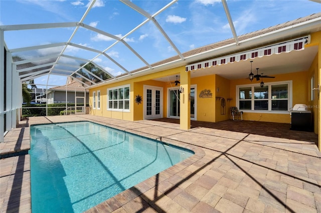 721 Manns Harbor Dr, Apollo Beach, FL 33572 - outdoor pool featuring ceiling fan, french doors, a patio, and a lanai