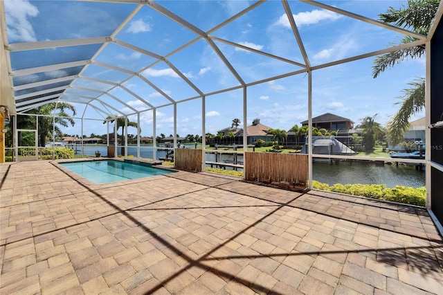 721 Manns Harbor Dr, Apollo Beach, FL 33572 - swimming pool featuring a patio area, a water view, and a lanai