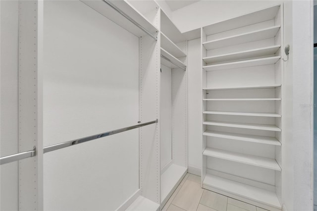 721 Manns Harbor Dr, Apollo Beach, FL 33572 - spacious closet featuring light tile patterned floors