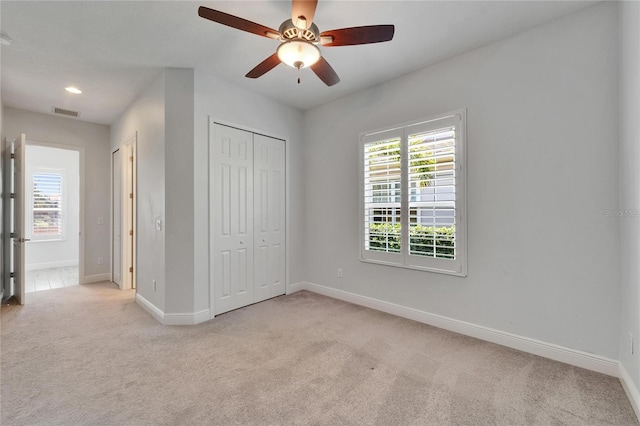 721 Manns Harbor Dr, Apollo Beach, FL 33572 - unfurnished bedroom with light colored carpet, a ceiling fan, and recessed lighting