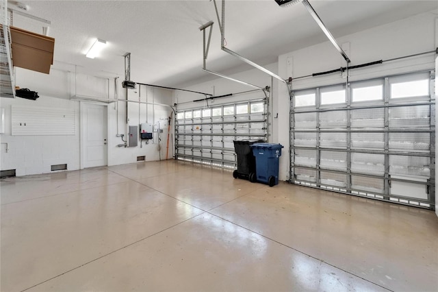 721 Manns Harbor Dr, Apollo Beach, FL 33572 - garage with a garage door opener and electric panel
