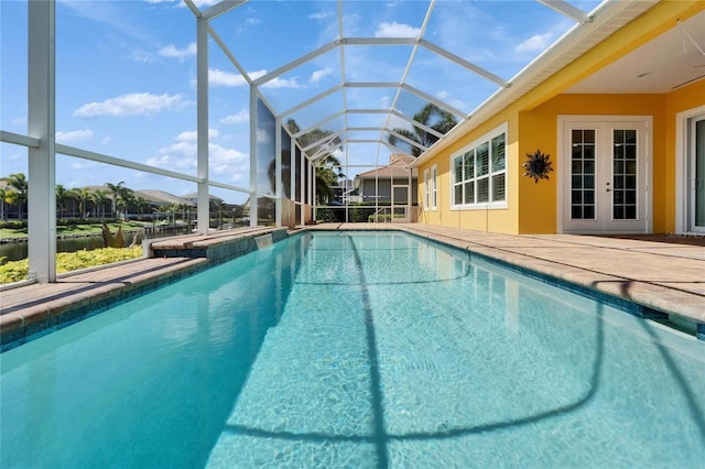 721 Manns Harbor Dr, Apollo Beach, FL 33572 - outdoor pool featuring a patio, a lanai, and french doors