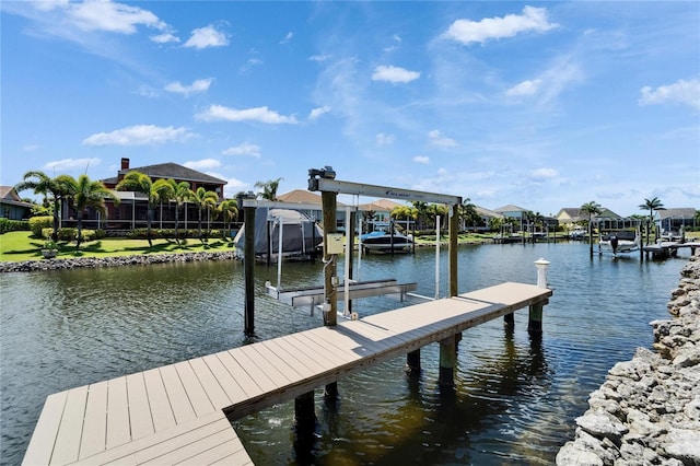 721 Manns Harbor Dr, Apollo Beach, FL 33572 - dock featuring boat lift, a water view, and a residential view