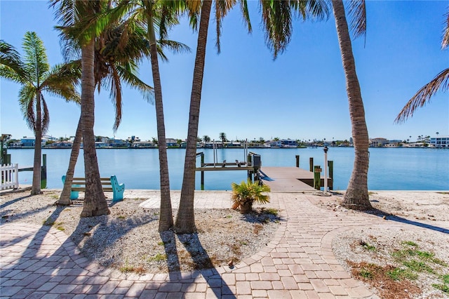 exterior space with a boat dock and boat lift