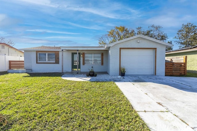 ranch-style home with a front yard and a garage