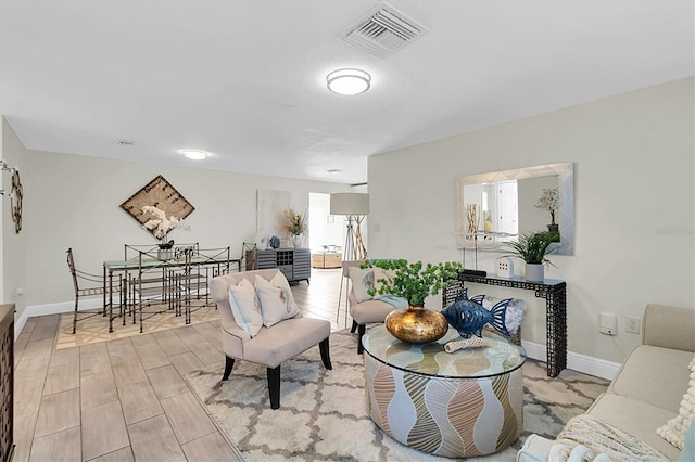 living room with light hardwood / wood-style flooring