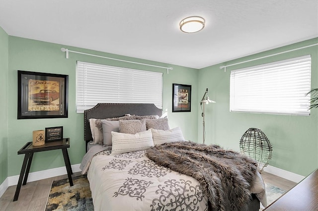 bedroom with light hardwood / wood-style flooring