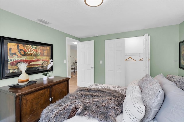 bedroom featuring a closet and hardwood / wood-style floors