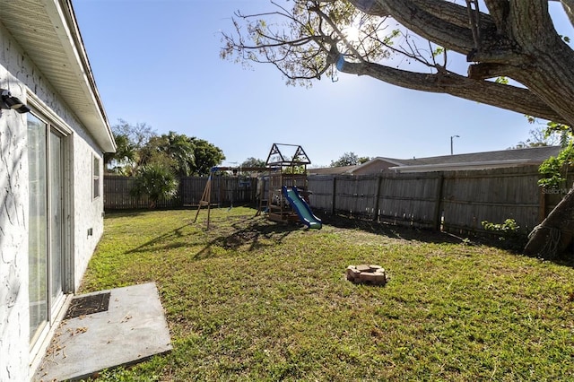 view of yard with a playground