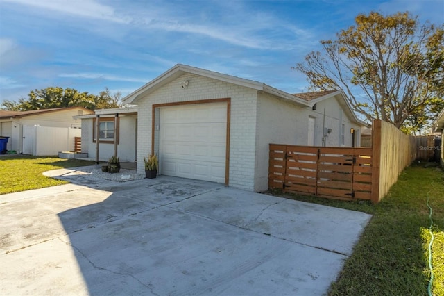 view of home's exterior featuring a yard and a garage