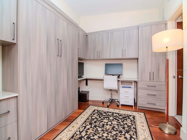 office area featuring built in desk and light hardwood / wood-style floors