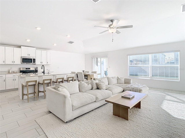 living room with ceiling fan