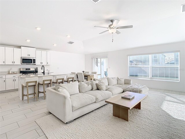 8849 Little Bluestem Dr, Land O Lakes, FL 34637 - living room with ceiling fan and recessed lighting