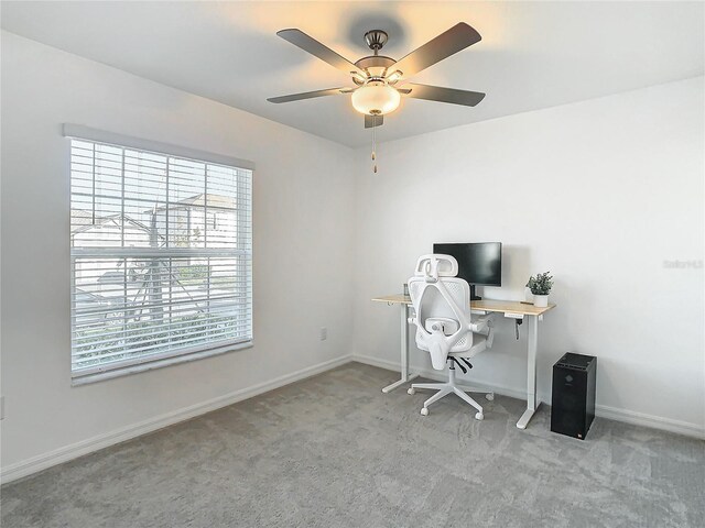 8849 Little Bluestem Dr, Land O Lakes, FL 34637 - carpeted home office featuring baseboards and ceiling fan
