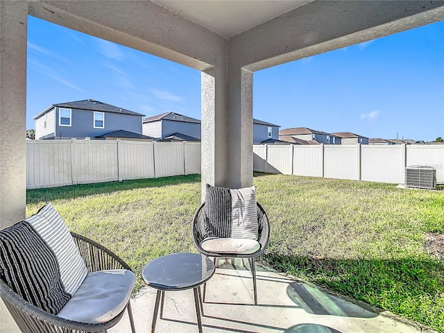 view of yard featuring a patio and central AC