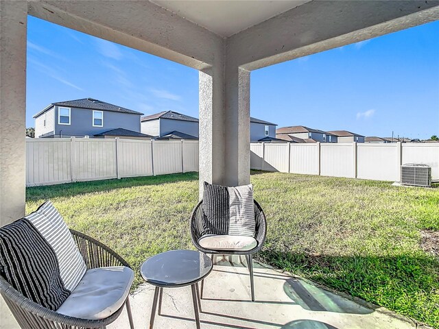 8849 Little Bluestem Dr, Land O Lakes, FL 34637 - view of yard featuring cooling unit, a patio area, and a residential view