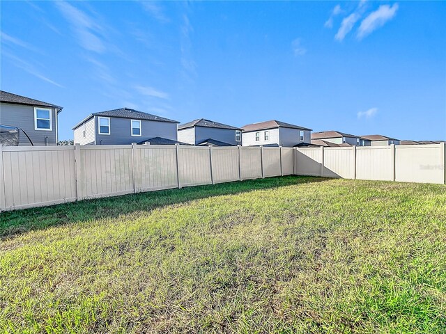 8849 Little Bluestem Dr, Land O Lakes, FL 34637 - view of yard with a residential view