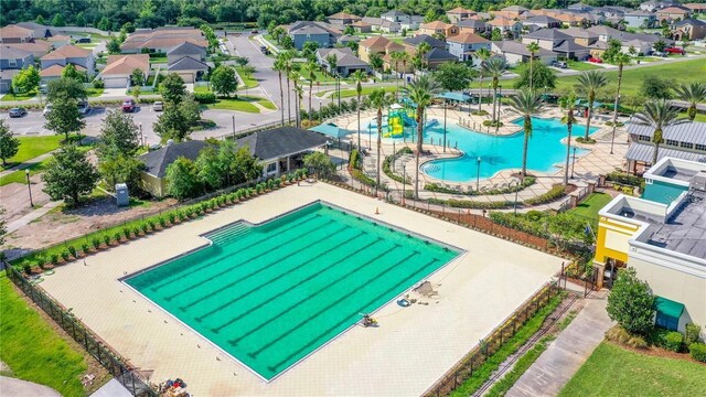 8849 Little Bluestem Dr, Land O Lakes, FL 34637 - aerial view of residential area featuring a pool