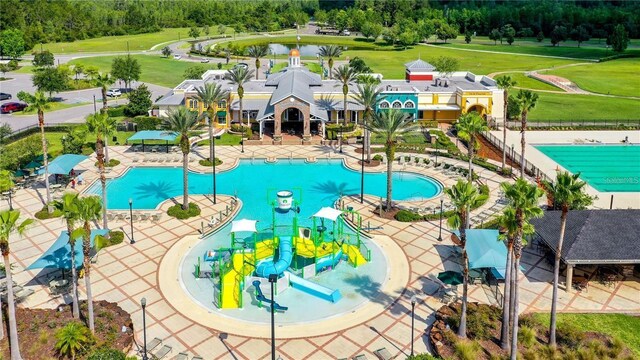 8849 Little Bluestem Dr, Land O Lakes, FL 34637 - view of swimming pool featuring a water play area and a water slide
