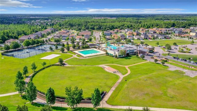 8849 Little Bluestem Dr, Land O Lakes, FL 34637 - aerial view of residential area featuring a heavily wooded area and a pool