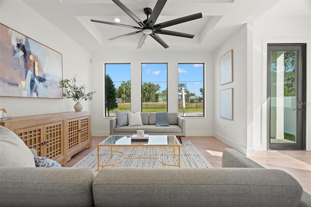 interior space featuring a tray ceiling and ceiling fan